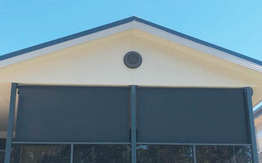 black awnings providing shelter to home outdoor decking