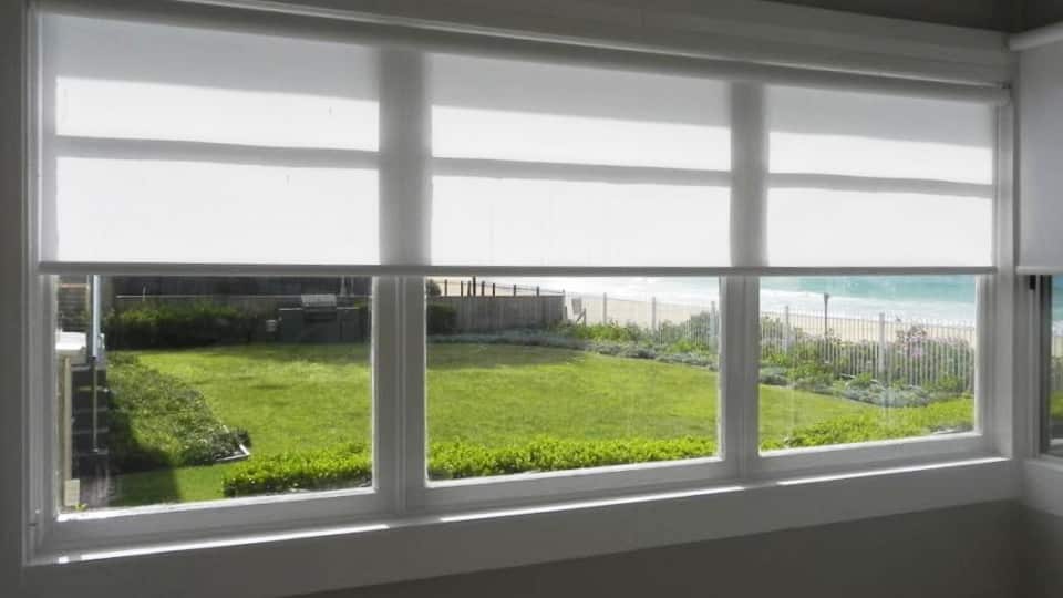 white blinds allowing natural light to come through a window on the Central Coast