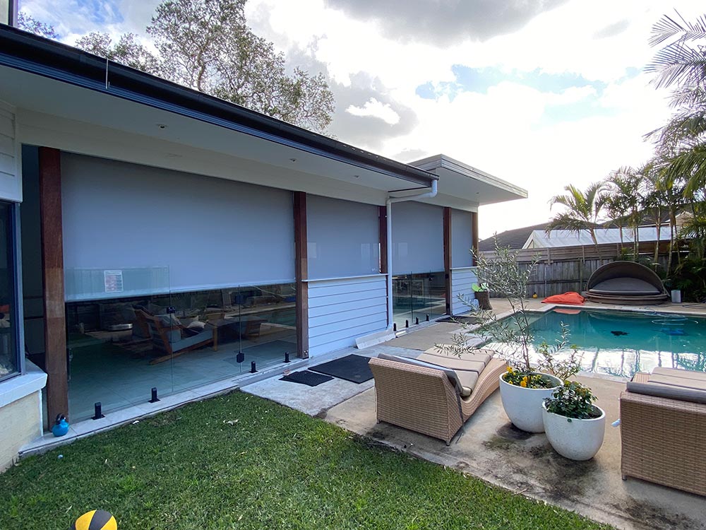 Awnings On A Backyard With Pool — Blinds, Doors, & Shutters in Central Coast, NSW