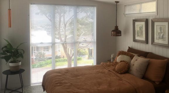 Bedroom Window with White Blinds — Blinds, Shutters & Awnings in Wyee, NSW
