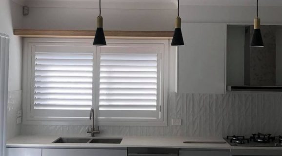 White Plantation Shutters in the Kitchen — Blinds, Shutters & Awnings in Wyee, NSW