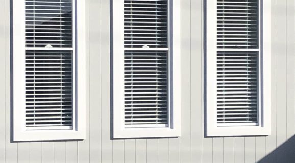 White blinds and grey wall — Blinds, Shutters & Awnings in Erina, NSW