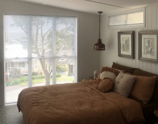 Brown bed and white blinds — Blinds, Shutters & Awnings in Erina, NSW